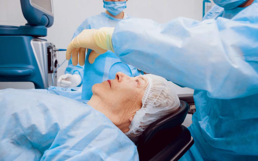 Ophthalmologist preparing patient for cataract surgery.