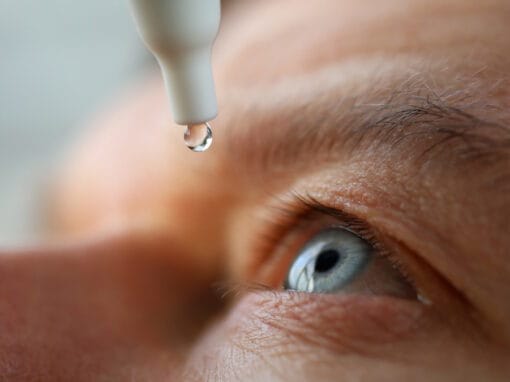 Man applies eye drop medication for glaucoma treatment in Pittsburgh.