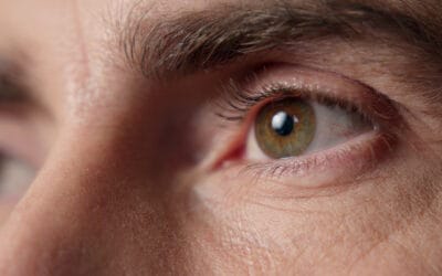 Close up of eyes of man thinking about vision health.