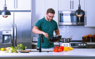 Man in Pittsburgh preparing meal with foods to protect eye health.