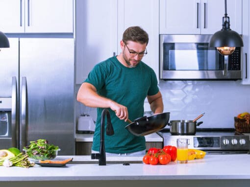 Man in Pittsburgh preparing meal with foods to protect eye health.