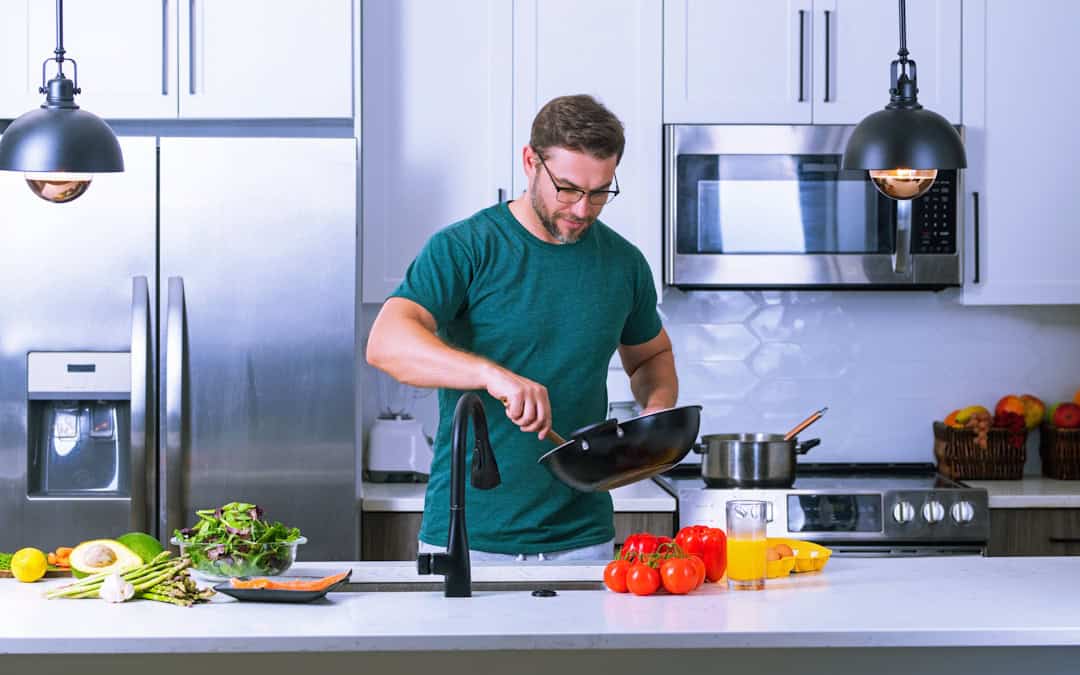 Man in Pittsburgh preparing meal with foods to protect eye health.