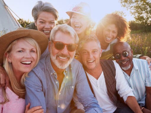 Happy group of people in 40s enjoying life outdoors.