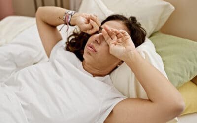 Woman in Pittsburgh having trouble sleeping and dry eye symptoms.