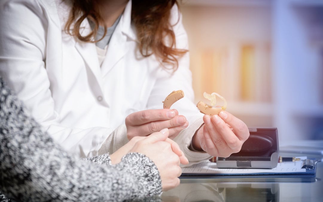 Audiologist in Pittsburgh explaining advanced technology used in hearing aids.
