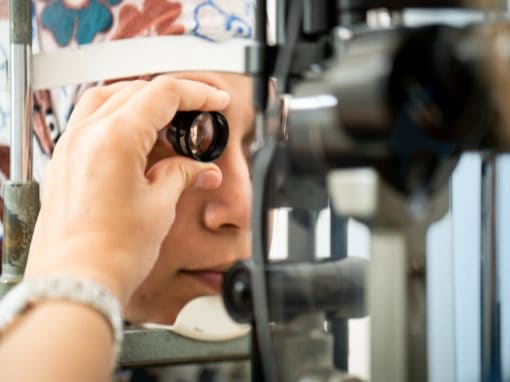 Woman having eye exam at Chang Eye Group following surgery in Pittsburgh.