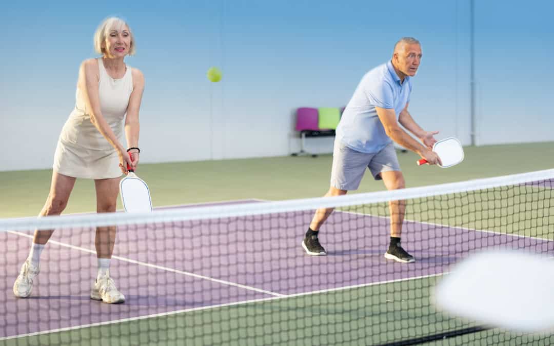 pittsburgh-senior-couple-pickleball-clear-vision Senior couple with clear vision in Pittsburgh playing pickleball.