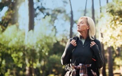 Senior woman hiking and staying active for healthy vision,